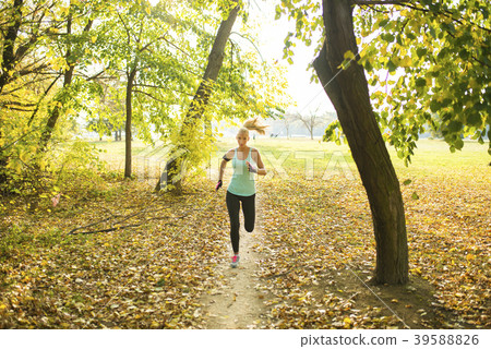 Sexy blonde running in the park 39588826