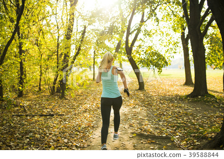 Sexy blonde running in the park 39588844