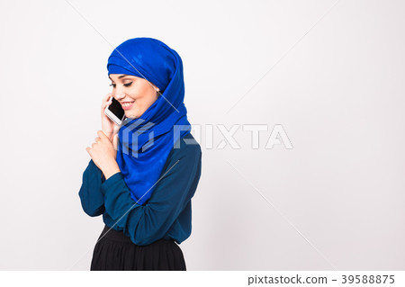 beautiful young arabian woman talking on cell beautiful young arabian woman talking on cell 39588875