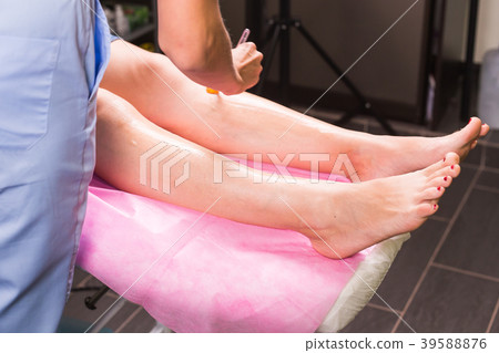 Hair removal cosmetology procedure from a 39588876