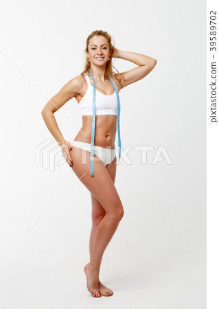 Picture of slender woman with centimeter ribbon in 39589702
