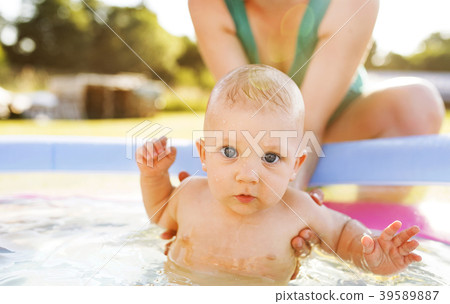 Little baby boy with his mother in the swimming Little baby boy with his mother in the swimming 39589887