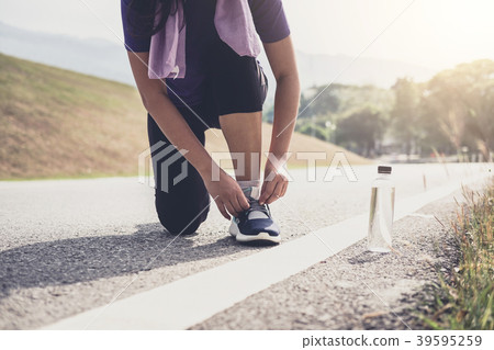 Healthy lifestyle, Runner tying running shoes getting ready for Healthy lifestyle, Runner tying running shoes getting ready for 39595259