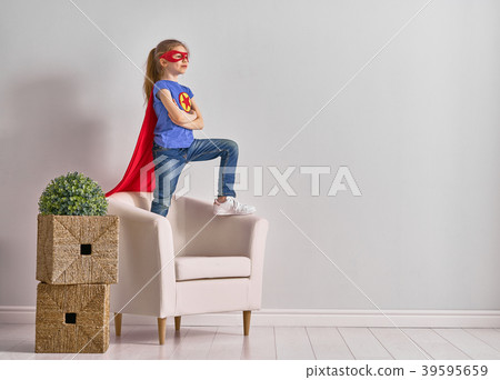 child is playing superhero child is playing superhero 39595659