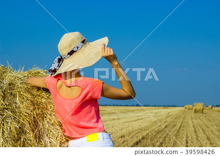 Sexy woman on hay stack . romantic girl outdoors Sexy woman on hay stack . romantic girl outdoors 39598426