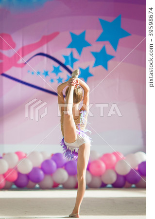 Little beautiful gymnast on carpet. Adorable 39598674