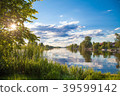 Summer sunset surise lake reflection sky clouds 39599142