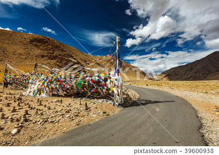 Road and Buddhist prayer flags (lungta) at Road and Buddhist prayer flags (lungta) at 39600938