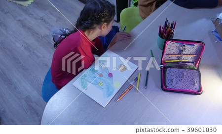 Little girl paint painting at table . schoolgirls Little girl paint painting at table . schoolgirls 39601030