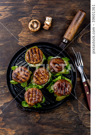 Grilled portobello bun mushroom burgers on cast 39601361