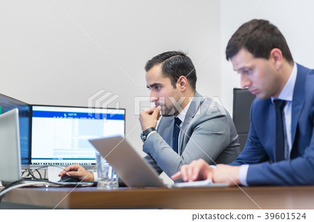 Corporate business team working in modern office. Corporate business team working in modern office. 39601524