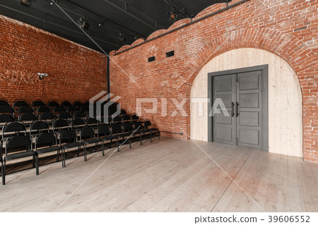 large door. Loft style. Hall with black chairs for 39606552