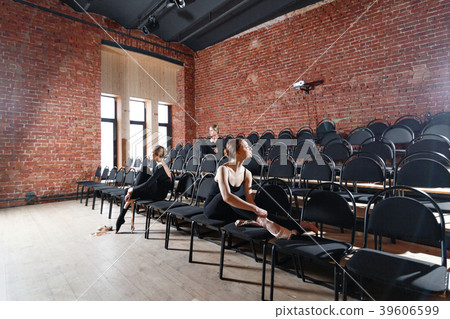 The ballet concept. Young ballerina girls sitting The ballet concept. Young ballerina girls sitting 39606599