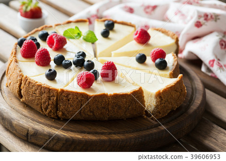 Classical Cheesecake with fresh berries on wooden Classical Cheesecake with fresh berries on wooden 39606953
