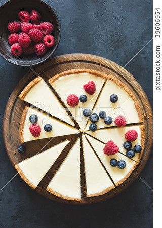 Classical cheesecake cut into slices, table top Classical cheesecake cut into slices, table top 39606954
