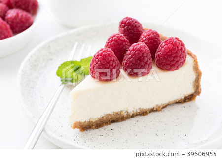 Cheesecake with fresh raspberries on white plate Cheesecake with fresh raspberries on white plate 39606955