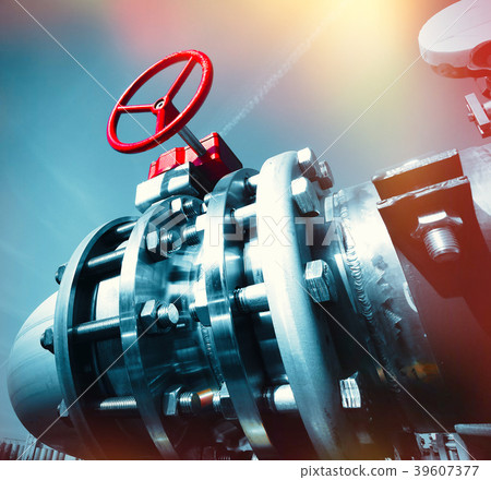 Steel pipelines and valves against blue sky 39607377