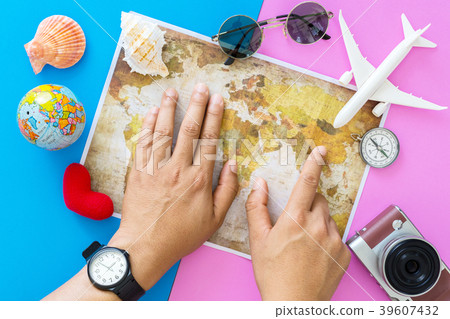 Young man planning travel on vacation trip. 39607432