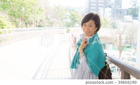 A woman standing on a bridge from Yamashita Park to a foreigner's cemetery A woman standing on a bridge from Yamashita Park to a foreigner's cemetery 39608290