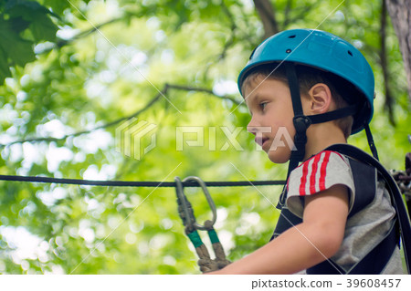 Five year boy on rope-way in forest Five year boy on rope-way in forest 39608457