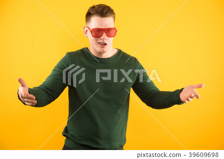 Portrait of young handsome smiling guy with Portrait of young handsome smiling guy with 39609698