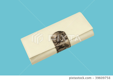 Leather purse on light blue background. Beige 39609758