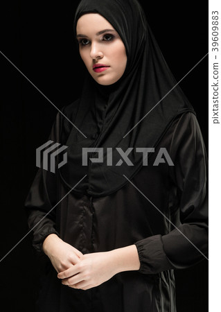Beautiful young muslim woman wearing black hijab Beautiful young muslim woman wearing black hijab 39609883