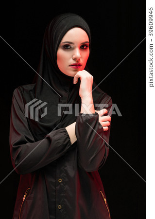Beautiful young muslim woman wearing black hijab Beautiful young muslim woman wearing black hijab 39609946