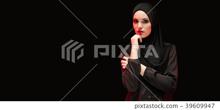 Beautiful young muslim woman wearing black hijab Beautiful young muslim woman wearing black hijab 39609947