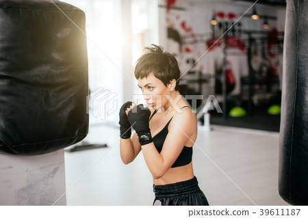 confident model doing strength exercises with confident model doing strength exercises with 39611187