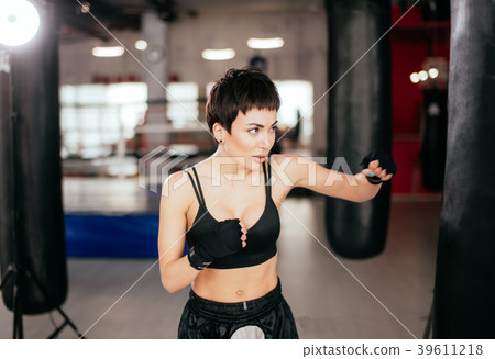 athlete is keeping hands up and punching 39611218
