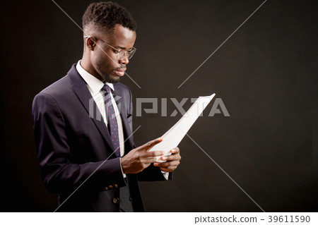 Successful worker reading papers in the office 39611590