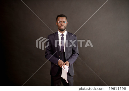serious black guy with contract on his hands 39611596