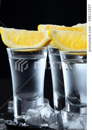 Vodka. Shots, glasses with vodka with lemon 39611937