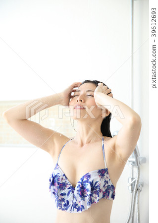 Woman taking a shower Woman taking a shower 39612693