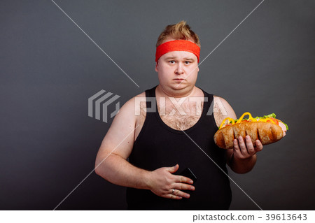 Fat man preparing for eating unhealthy burger Fat man preparing for eating unhealthy burger 39613643