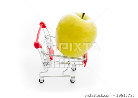 Shopping cart with big green apple on white Shopping cart with big green apple on white 39613755