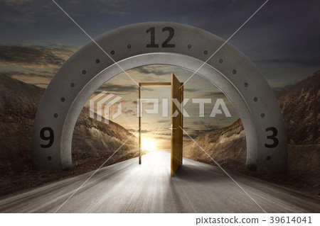 Gateway arch with clock face and open door 39614041