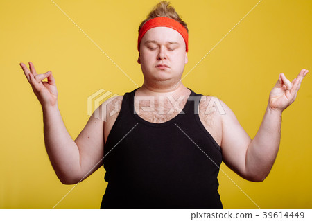 fat man relaxing with meditation on yellow 39614449