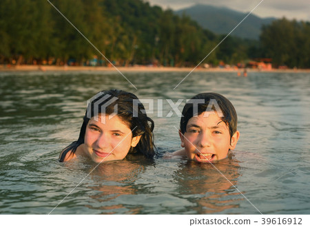 teenager siblings couple brother and sister swimming in the sea teenager siblings couple brother and sister swimming in the sea 39616912
