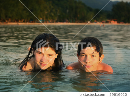 teenager siblings couple brother and sister swimming in the sea teenager siblings couple brother and sister swimming in the sea 39616920