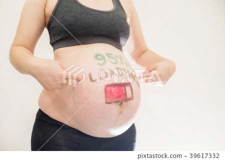 Pregnant with loading painted on belly Pregnant with loading painted on belly 39617332
