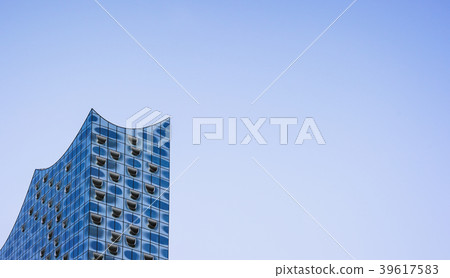 Top shape of Elbphilharmonie on bright blue sky Top shape of Elbphilharmonie on bright blue sky 39617583