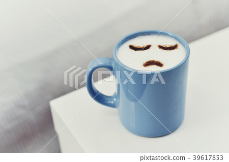 cup of cappuccino with a sad face 39617853