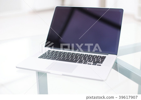Laptop with blank screen on table. Laptop with blank screen on table. 39617907