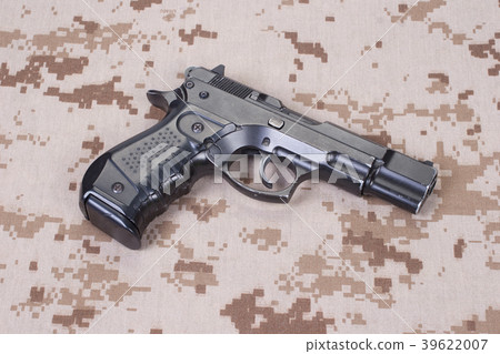 handgun on camouflage uniform 39622007