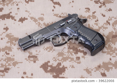 handgun on camouflage uniform 39622008