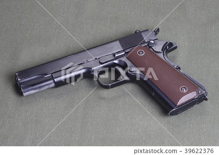 background with colt government m1911 background with colt government m1911 39622376