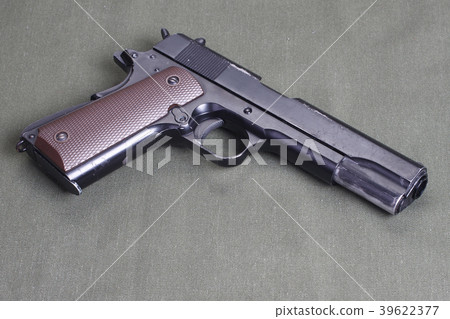 background with colt government m1911 background with colt government m1911 39622377