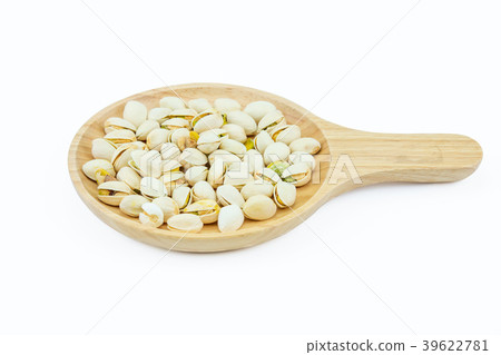 Salted pistachio nuts on wooden plate Salted pistachio nuts on wooden plate 39622781